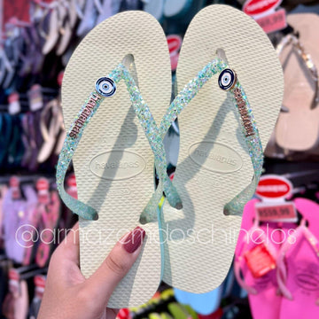 Havaianas Slim Glitter Flrish + Pingente Olho grego - Armazém dos Chinelos  